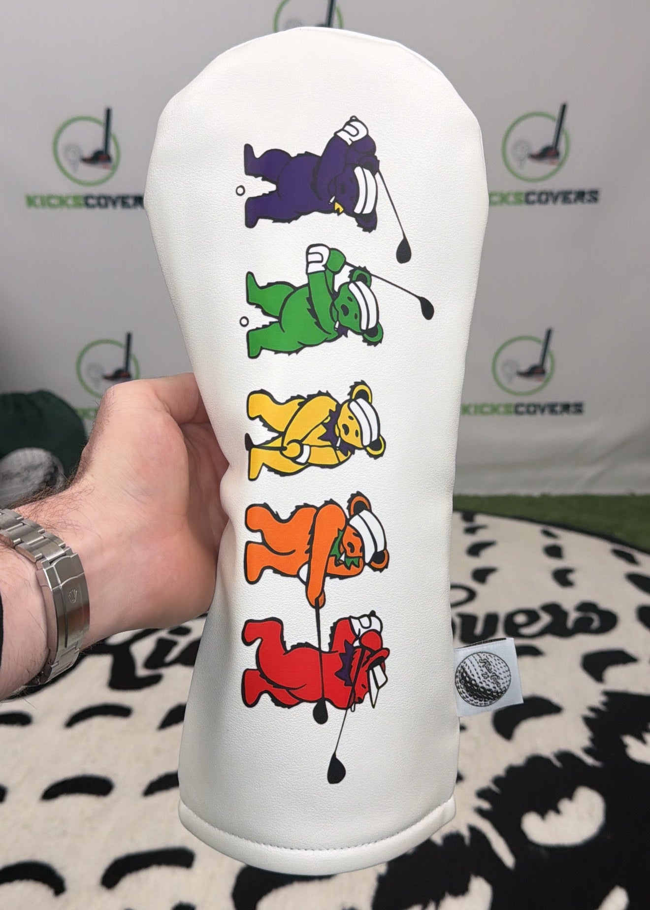 dancing bear logo on a white driver headcover 